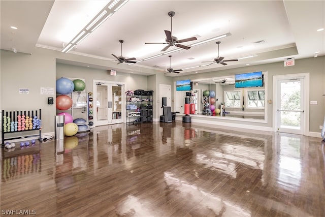 exercise room featuring a tray ceiling