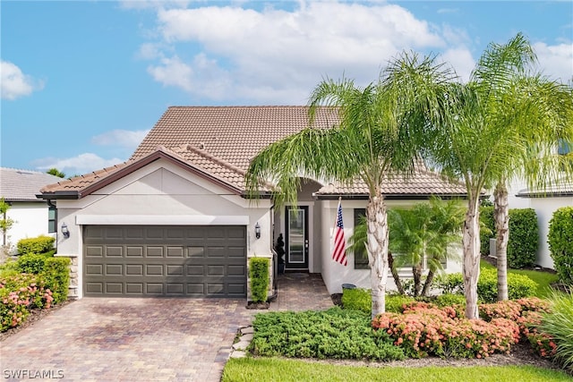 view of front of property with a garage