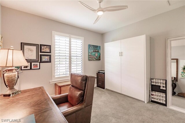 office featuring ceiling fan and light colored carpet