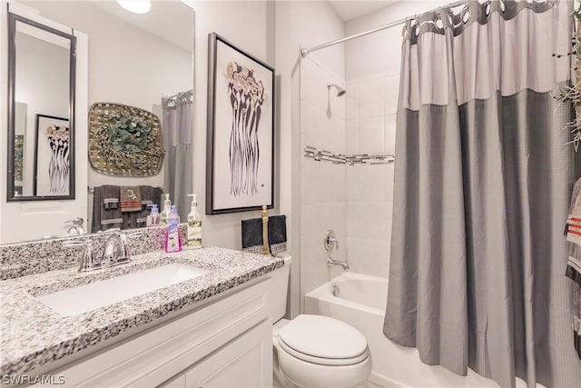 full bathroom with toilet, vanity, and shower / bath combination with curtain