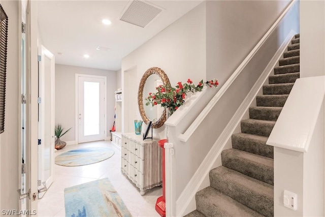 foyer with light tile patterned flooring