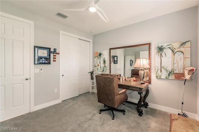 carpeted office space with ceiling fan