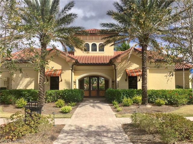 mediterranean / spanish-style home featuring french doors