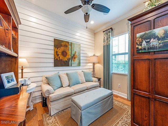 interior space featuring hardwood / wood-style flooring, ceiling fan, and ornamental molding