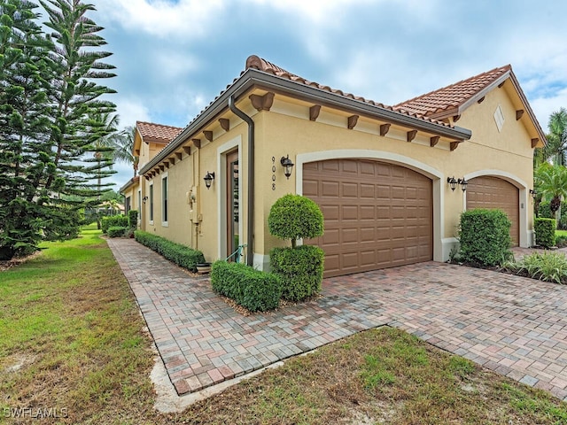 view of side of home with a garage