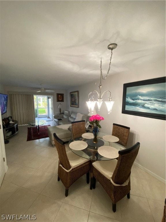 dining area with a notable chandelier and light tile floors