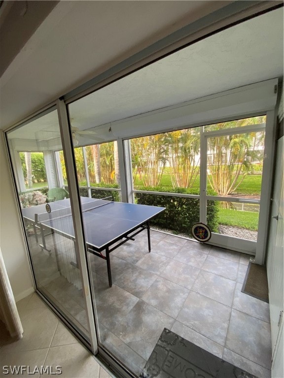 unfurnished sunroom with a wealth of natural light