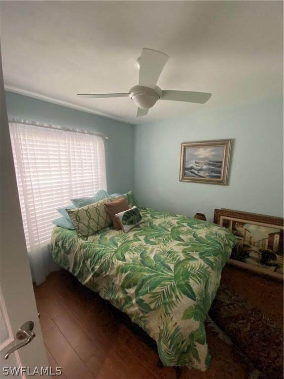 bedroom featuring hardwood / wood-style flooring and ceiling fan