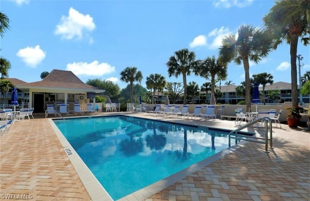 view of swimming pool with a patio area