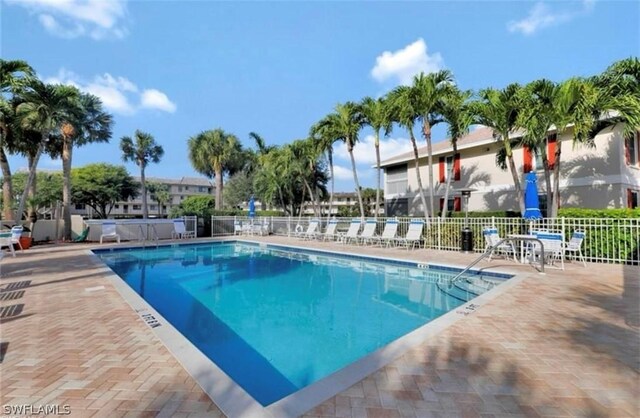 view of swimming pool with a patio area