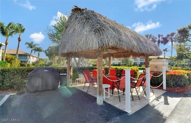 view of property's community with a patio and a gazebo