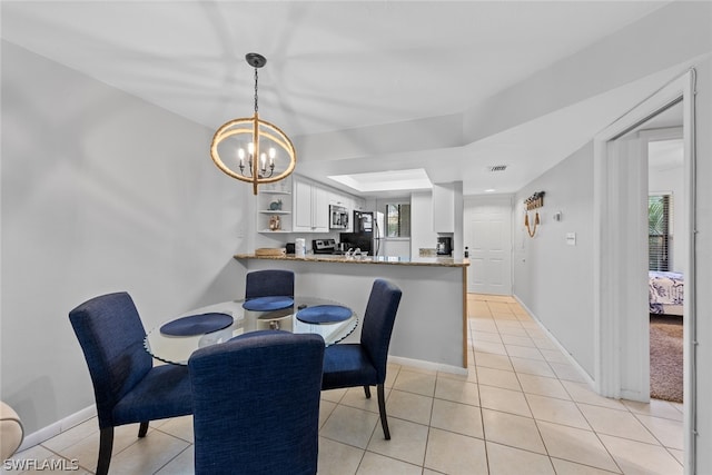 carpeted dining area featuring a healthy amount of sunlight and an inviting chandelier