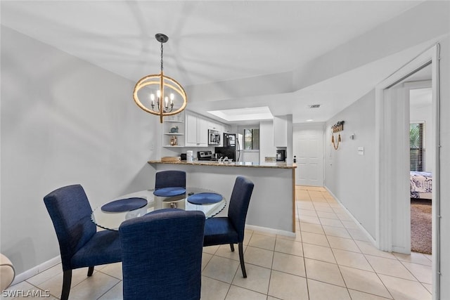 dining room with light tile patterned flooring, visible vents, baseboards, and an inviting chandelier