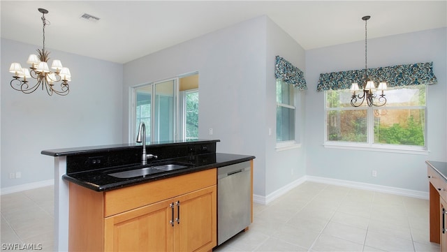 kitchen featuring sink, an island with sink, stainless steel dishwasher, and a notable chandelier