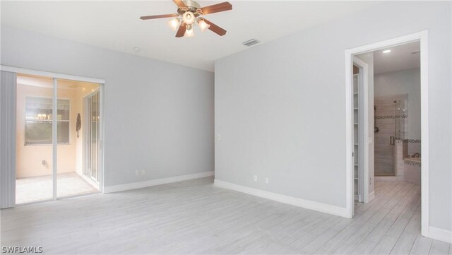 spare room with light hardwood / wood-style floors and ceiling fan