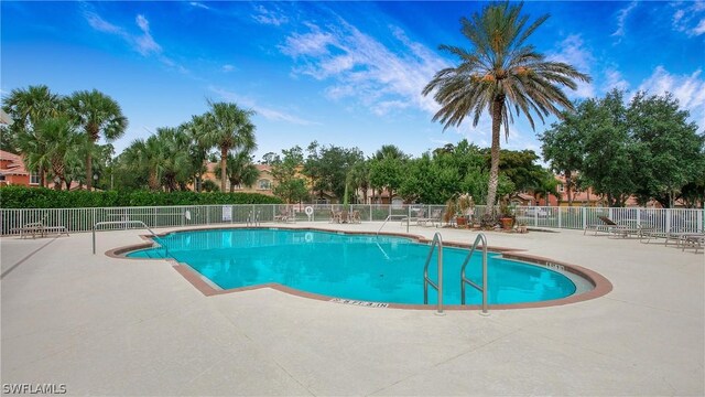 view of swimming pool with a patio area