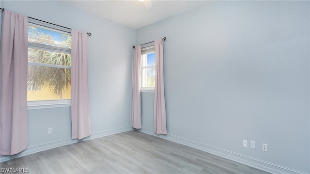 empty room with light hardwood / wood-style floors