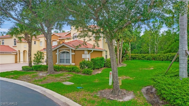 mediterranean / spanish-style house featuring a front yard