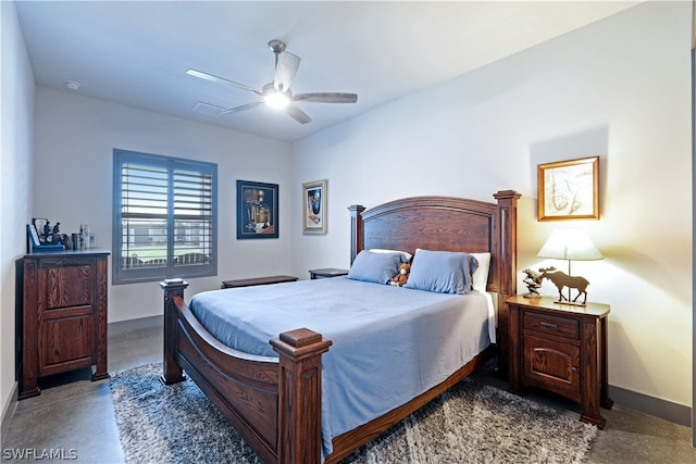 bedroom with dark colored carpet and ceiling fan