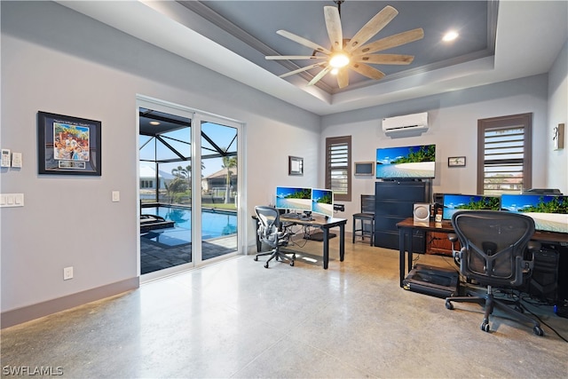 office area featuring a wall unit AC, ceiling fan, and a raised ceiling