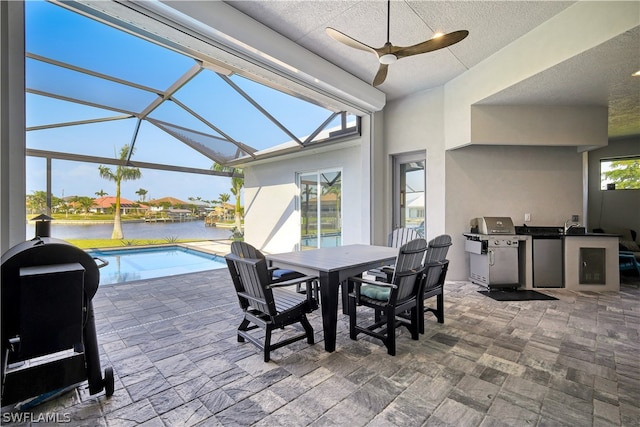 interior space featuring ceiling fan and a water view