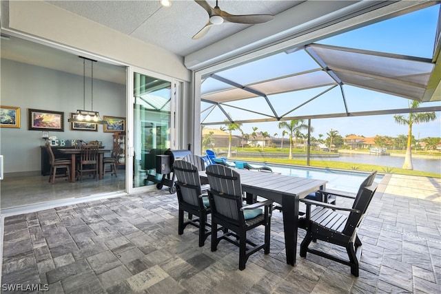 sunroom with lofted ceiling and ceiling fan