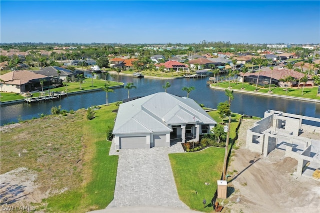 birds eye view of property featuring a water view