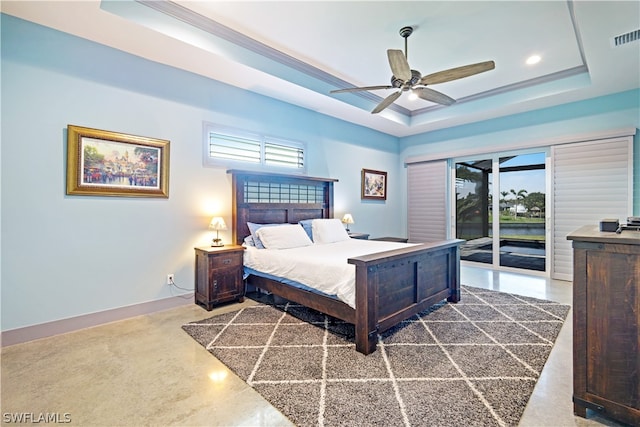 bedroom featuring access to exterior, ceiling fan, and a raised ceiling