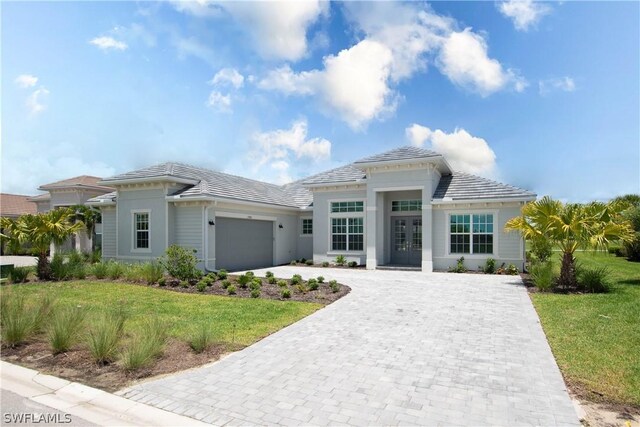 view of front facade with a front lawn and a garage