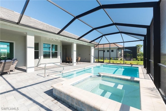 view of swimming pool with a patio area, glass enclosure, and an in ground hot tub