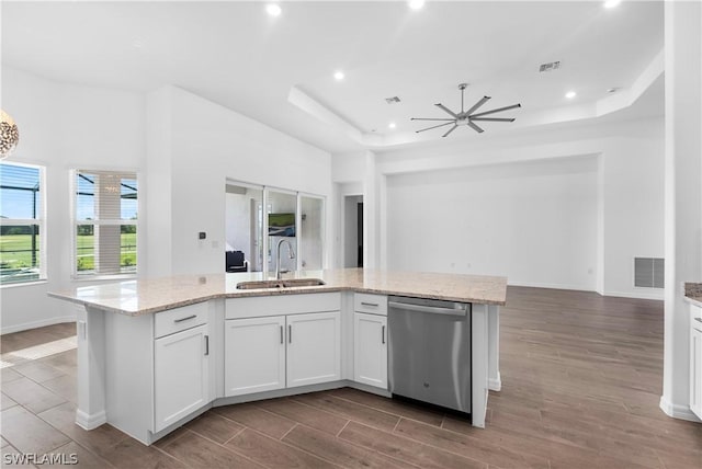 kitchen featuring a kitchen island with sink, dishwasher, white cabinets, and sink