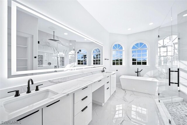 bathroom with vanity and independent shower and bath