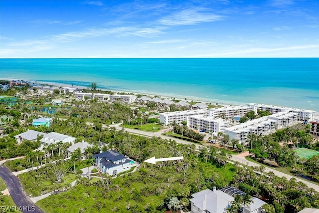 aerial view with a water view and a view of the beach