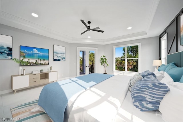 bedroom with ceiling fan, a raised ceiling, access to outside, and multiple windows