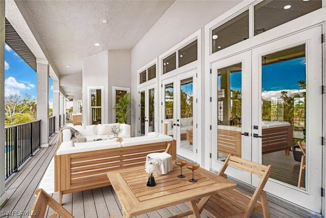 sunroom with a wealth of natural light and french doors