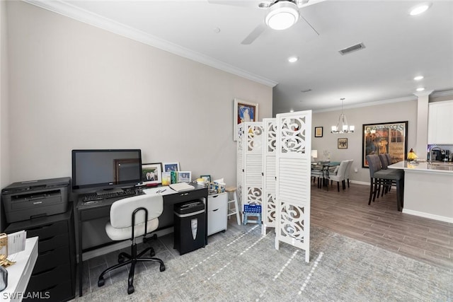 home office featuring crown molding, light hardwood / wood-style flooring, and ceiling fan with notable chandelier