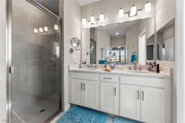 bathroom with tile patterned flooring, vanity, and a shower with shower door