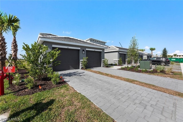 view of front of home with a garage