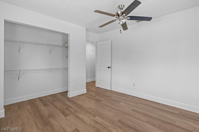 unfurnished bedroom with ceiling fan, a closet, and light hardwood / wood-style flooring