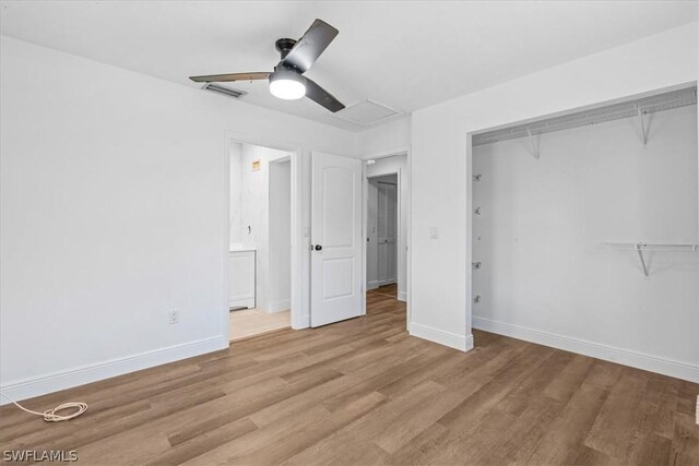 unfurnished bedroom featuring ceiling fan, a closet, and light hardwood / wood-style flooring