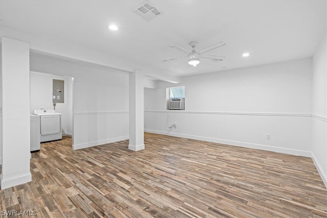 interior space featuring hardwood / wood-style flooring, ceiling fan, and washer / clothes dryer