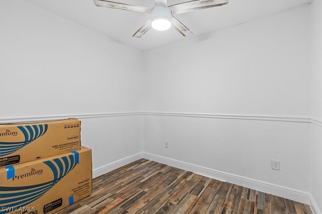 living area featuring ceiling fan and dark hardwood / wood-style floors