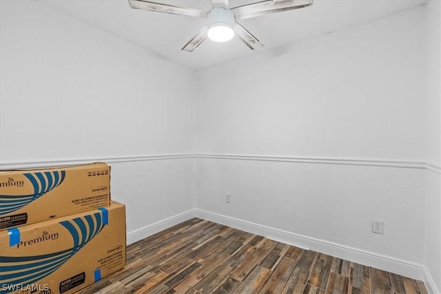 empty room with dark wood-type flooring and ceiling fan