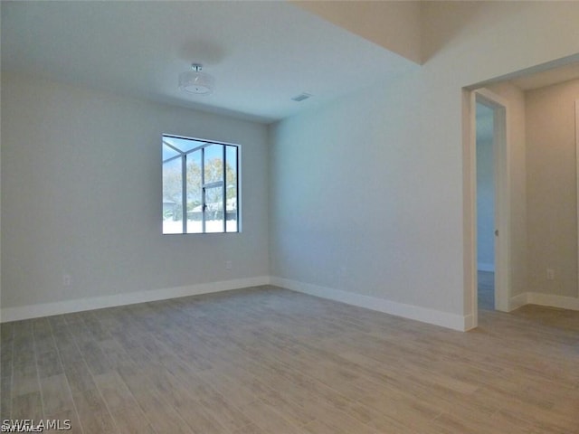 unfurnished room featuring light hardwood / wood-style floors