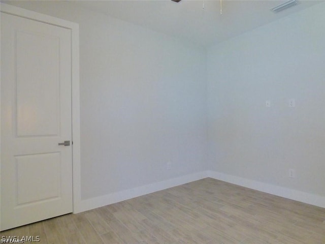 unfurnished room featuring light wood-type flooring