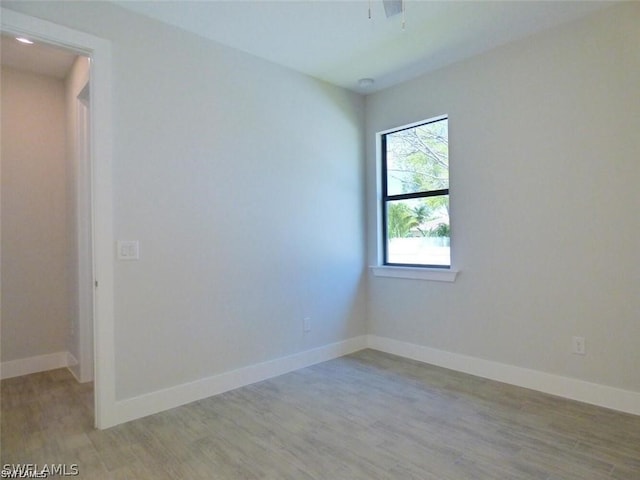 spare room featuring light hardwood / wood-style flooring