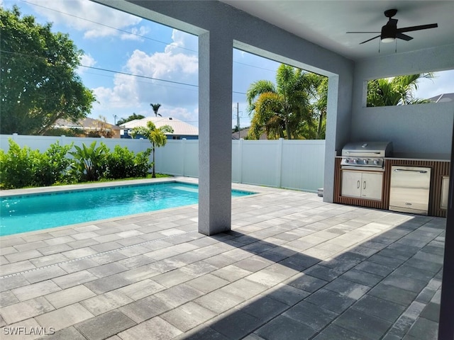 view of swimming pool featuring a patio, a fenced backyard, area for grilling, a ceiling fan, and grilling area