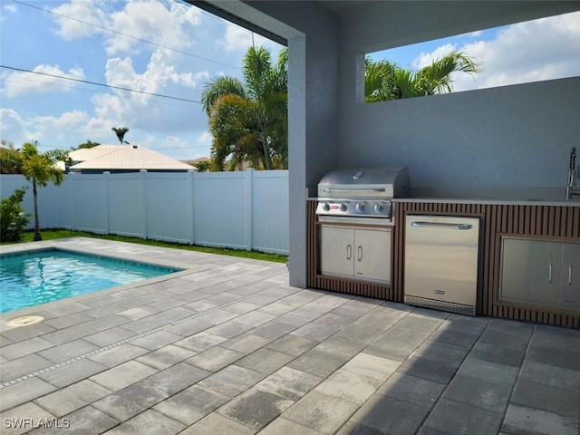 view of pool with a fenced backyard, a patio, grilling area, and area for grilling