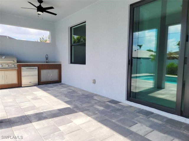 view of patio with a sink, grilling area, area for grilling, and ceiling fan