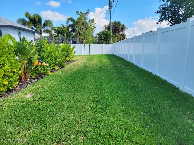 view of yard with a fenced backyard